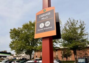 Cherokee Mills "Permit Required" sign in a parking lot